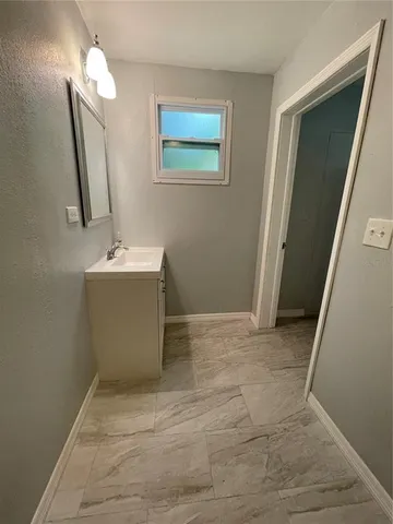 a view of an empty room with a sink