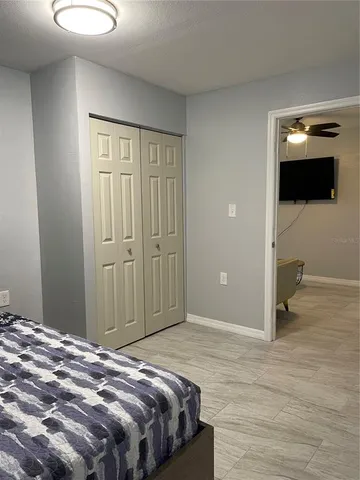 a bedroom with a bed and a view of bathroom