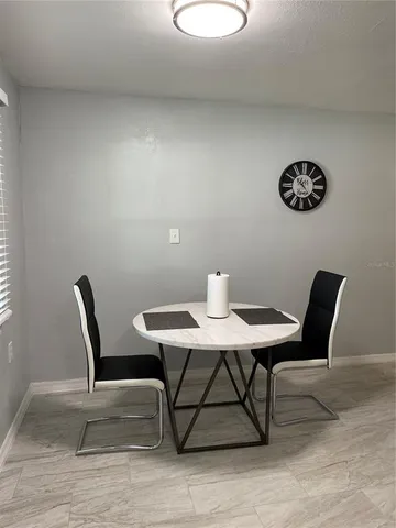 a view of a workspace with furniture