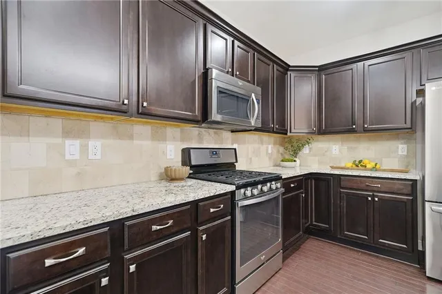 a view of a livingroom with a ceiling fan and window