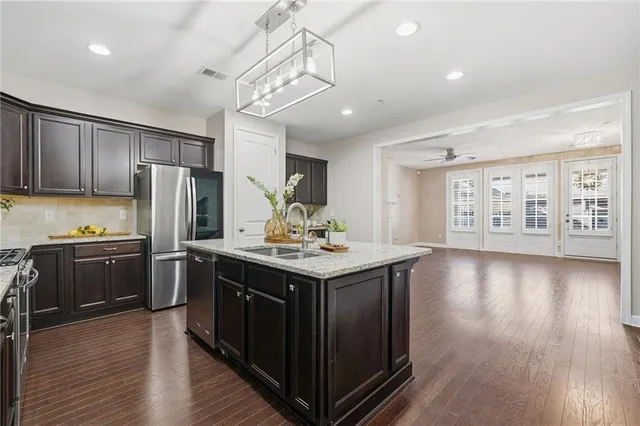a bathroom with a sink vanity and mirror