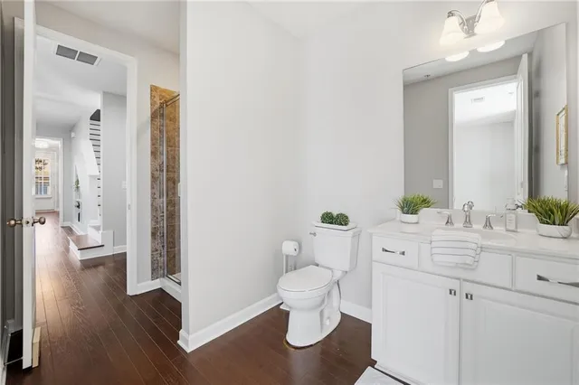 a bathroom with a sink a mirror and a toilet