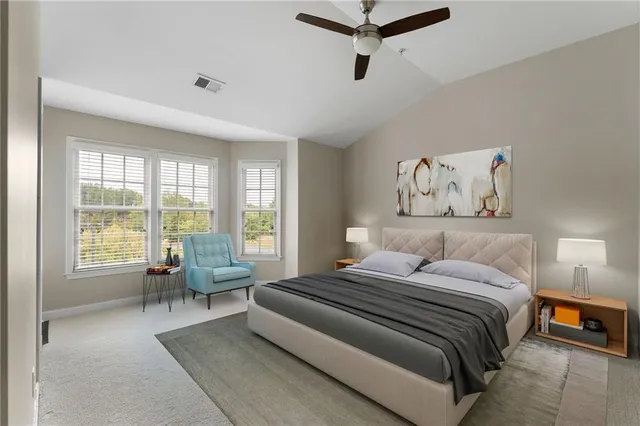 an aerial view of a house with outdoor space and sitting area