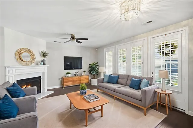 a kitchen with stainless steel appliances granite countertop a sink stove and wooden floor