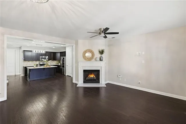 a kitchen with granite countertop wooden cabinets and white appliances
