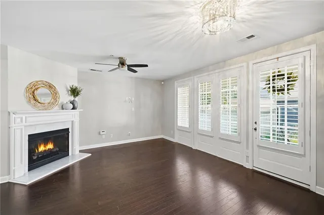 a bathroom with a sink a toilet a large mirror and shower
