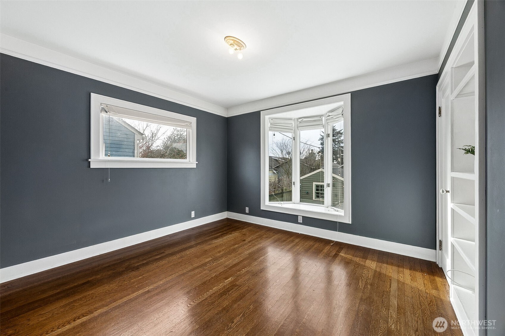 2819 Northwest 68th Street Seattle, WA 98117 - Photo 11 of 39 a view of an empty room with wooden floor and a window