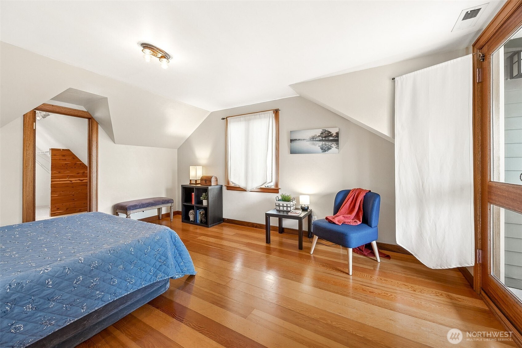 2819 Northwest 68th Street Seattle, WA 98117 - Photo 14 of 39 a bedroom with a bed and wooden floor
