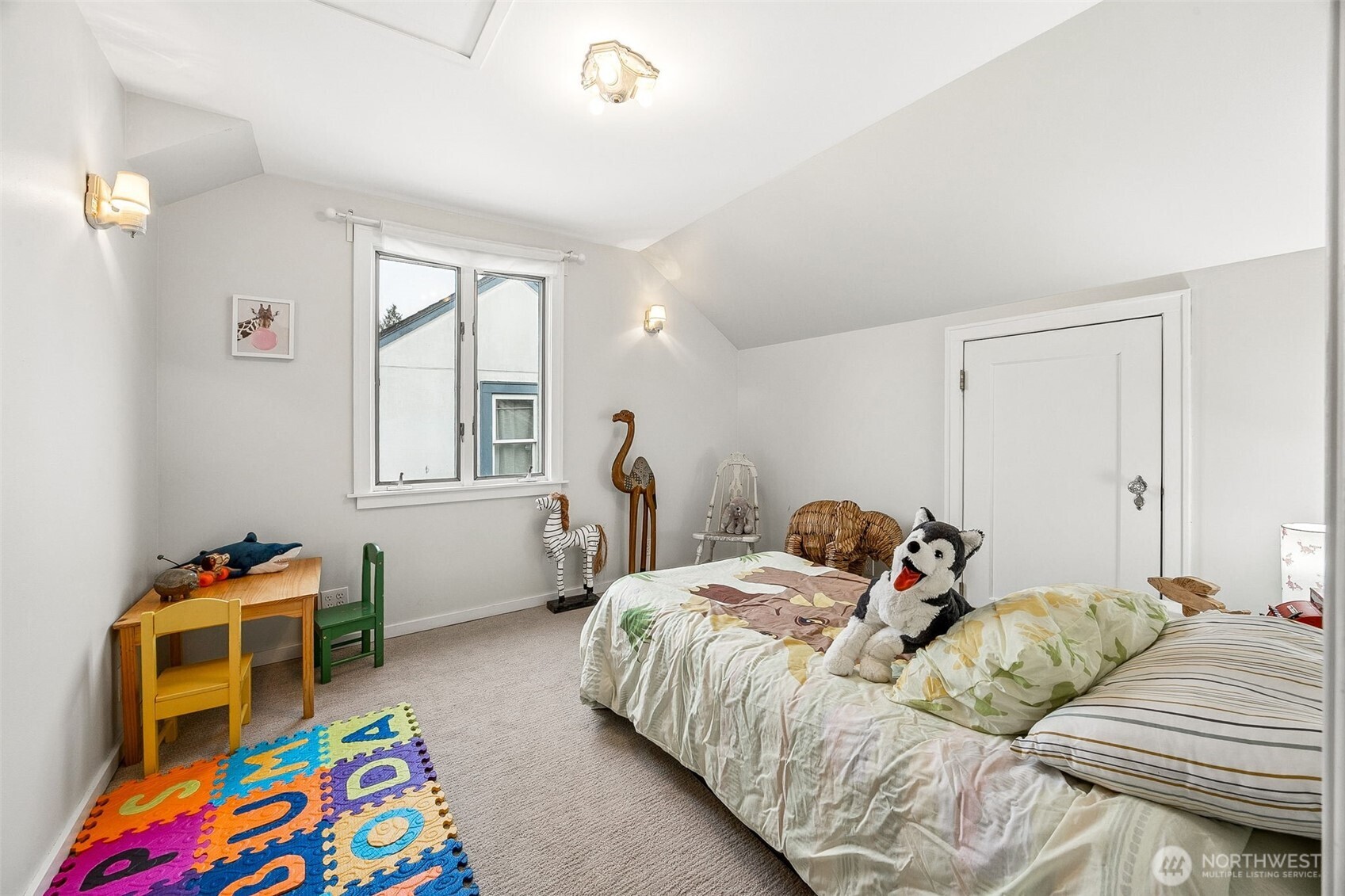2819 Northwest 68th Street Seattle, WA 98117 - Photo 21 of 39 a bedroom with a bed and a window