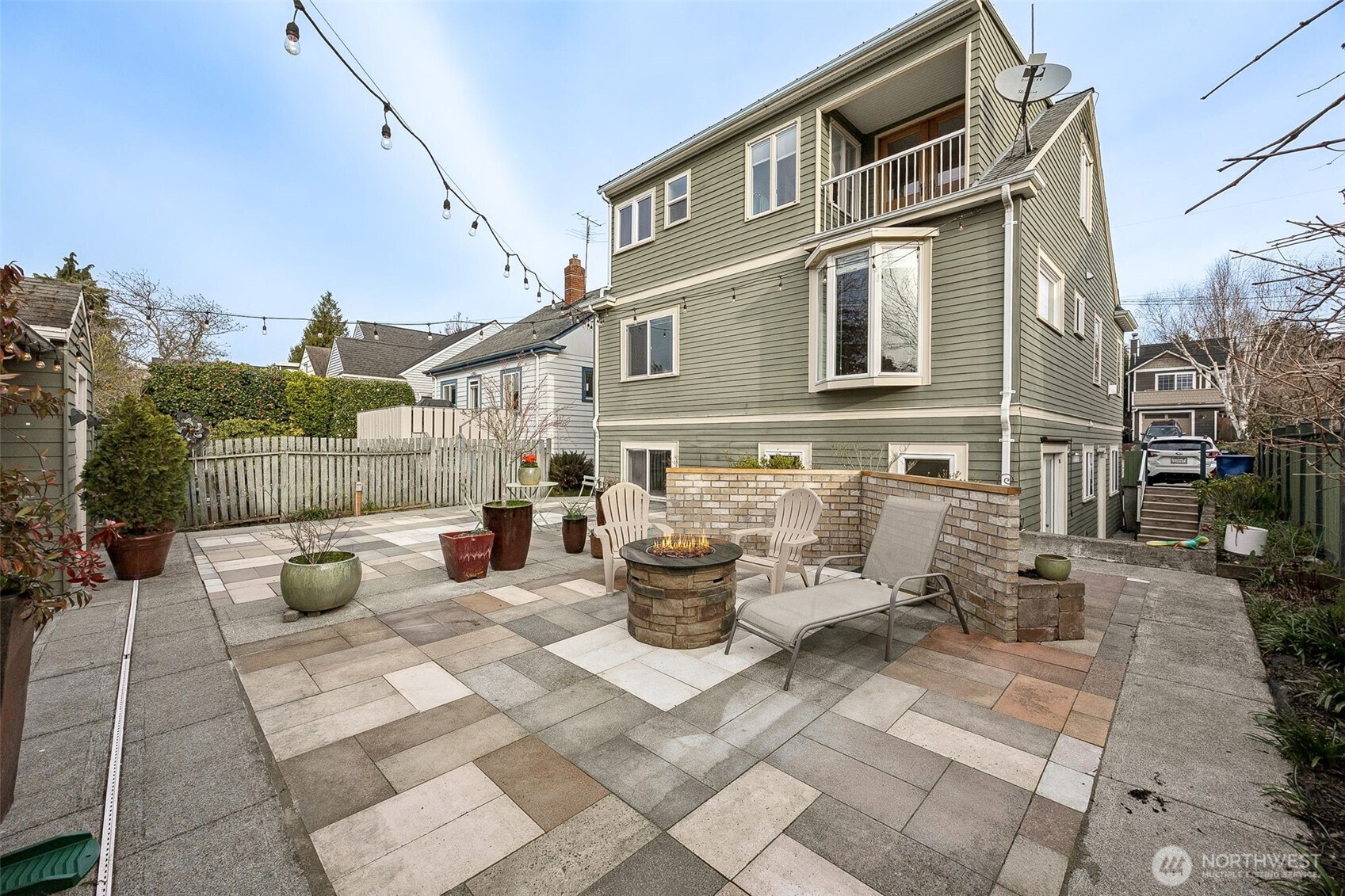 2819 Northwest 68th Street Seattle, WA 98117 - Photo 22 of 39 a view of a patio with couches chairs and potted plants