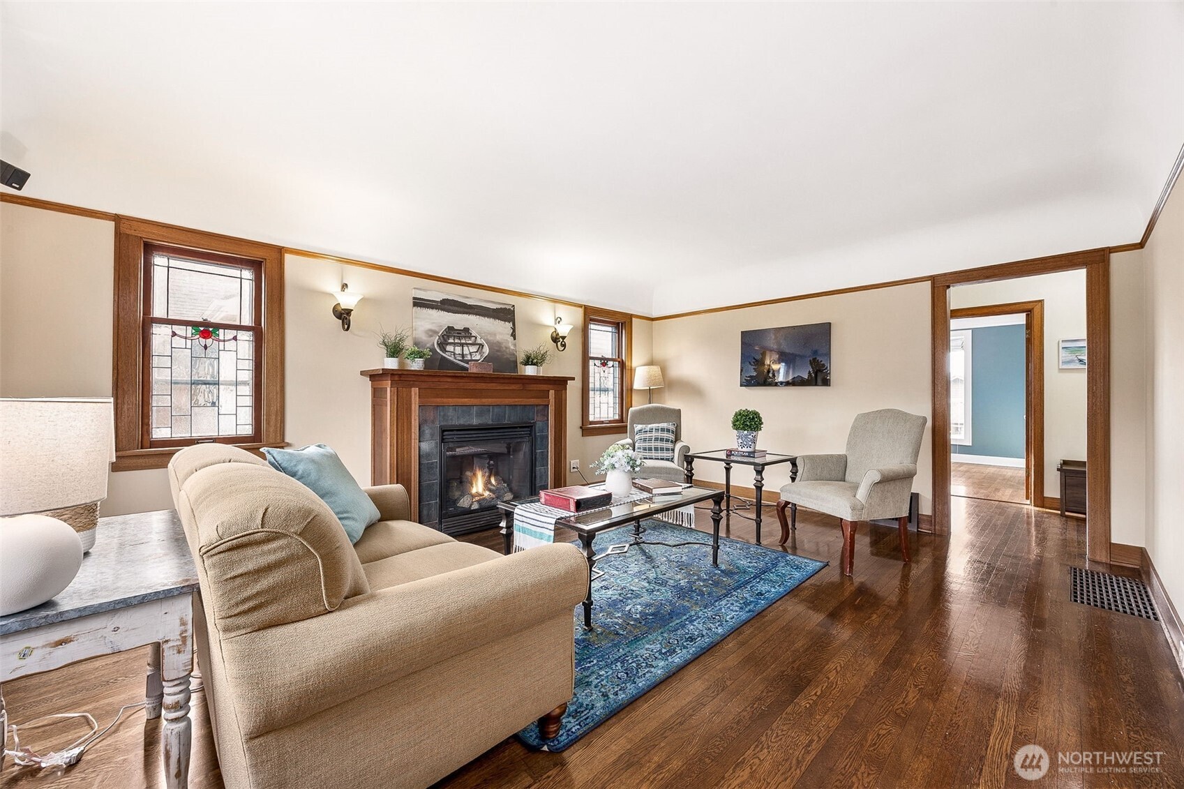 2819 Northwest 68th Street Seattle, WA 98117 - Photo 4 of 39 a living room with furniture and a fireplace