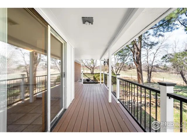 a view of balcony with wooden floor