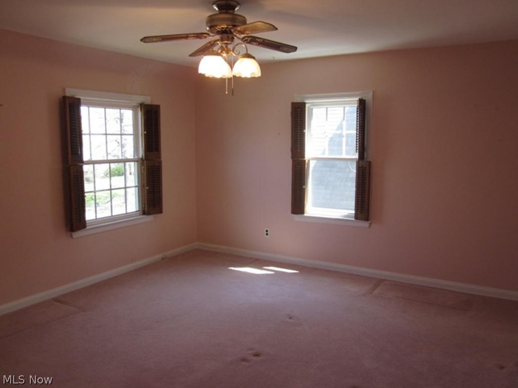 2390 Queenston Road Cleveland, OH 44118 - Photo 11 of 17 Master Bedroom with ceiling fan ~ Hardwood floors under carpet.