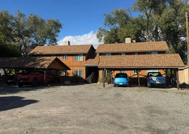 an outdoor view of a house with garage