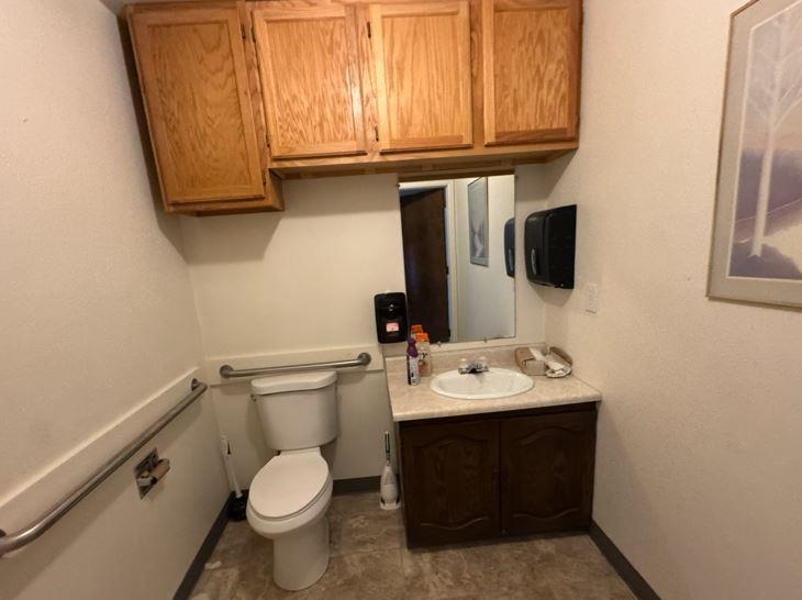 2718 Patterson Road Grand Junction, CO 81506 - Photo 13 of 13 a bathroom with a toilet sink and mirror