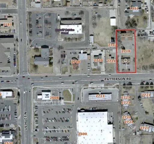 a bed sitting in a bedroom next to a window with tv