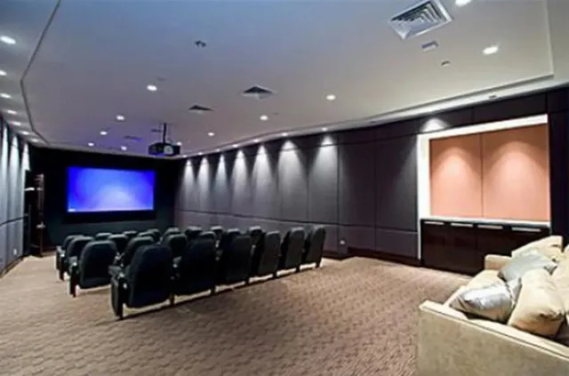 a projector room with furniture projector screen