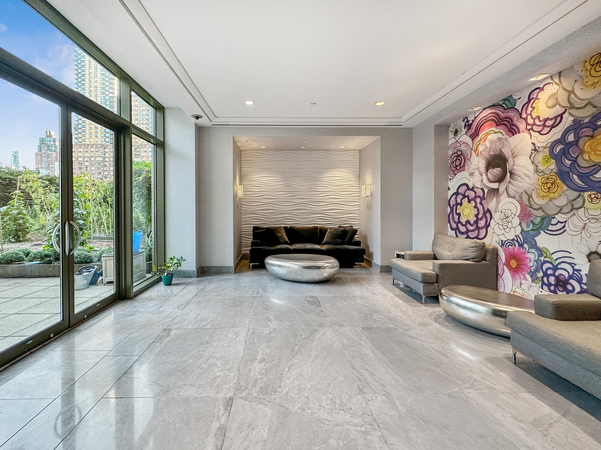 100 Riverside Boulevard, Unit 31B Manhattan, NY 10069 - Photo 8 of 17 a living room with furniture and a floor to ceiling window