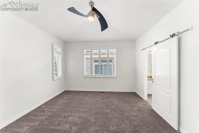 a bedroom with bed and a window