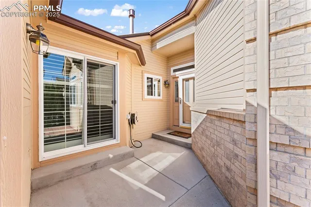 a view of a house with a door and wooden floor