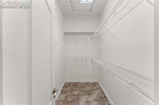 a view of a livingroom with furniture hardwood floor and hallway
