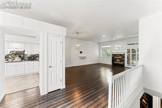 a kitchen with stainless steel appliances granite countertop a refrigerator stove and sink