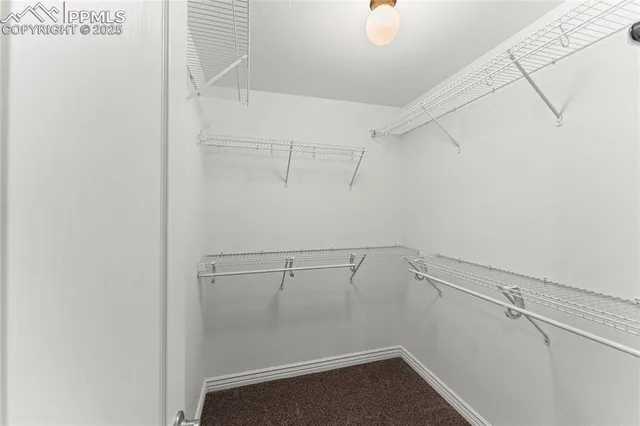 a view of room with white cabinets