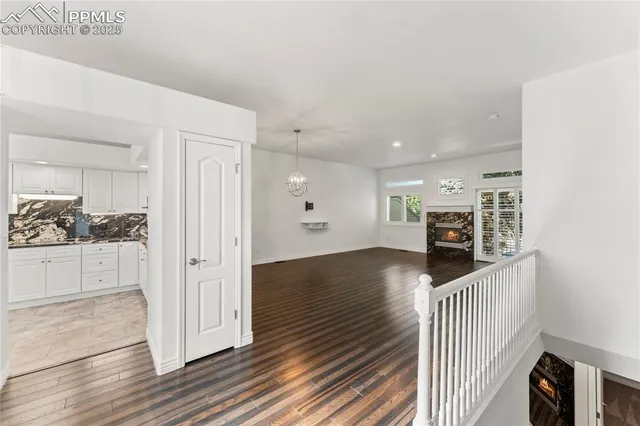 a view of an entryway with wooden floor