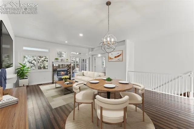 a view of empty room with wooden floor and window
