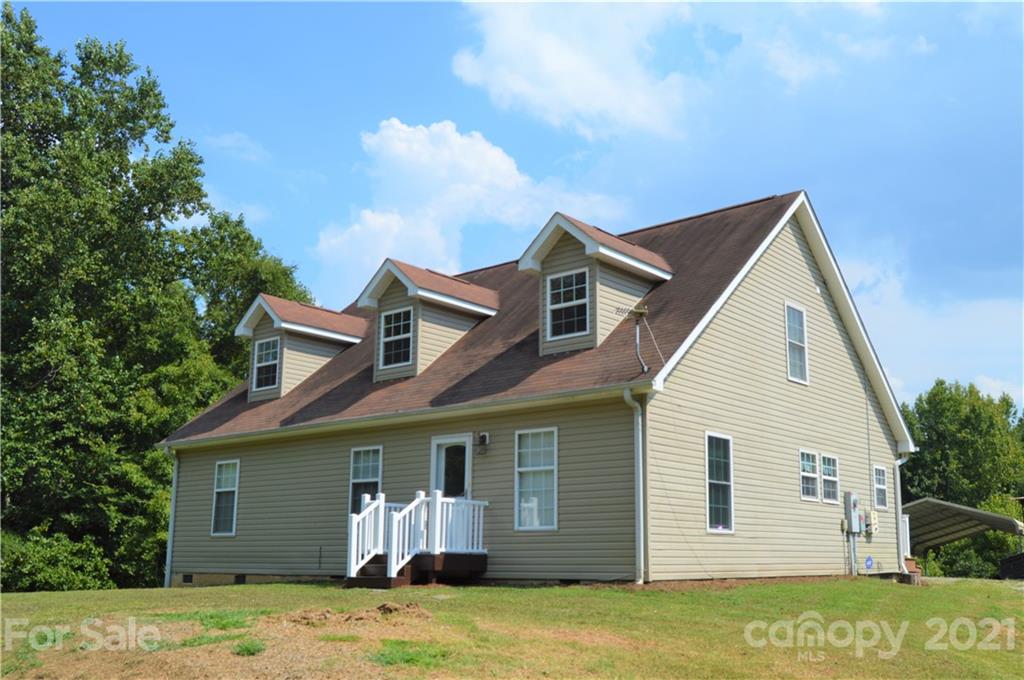 10835 Cool Springs Road Woodleaf, NC 27054 - Photo 1 of 35 a view of a house with a yard