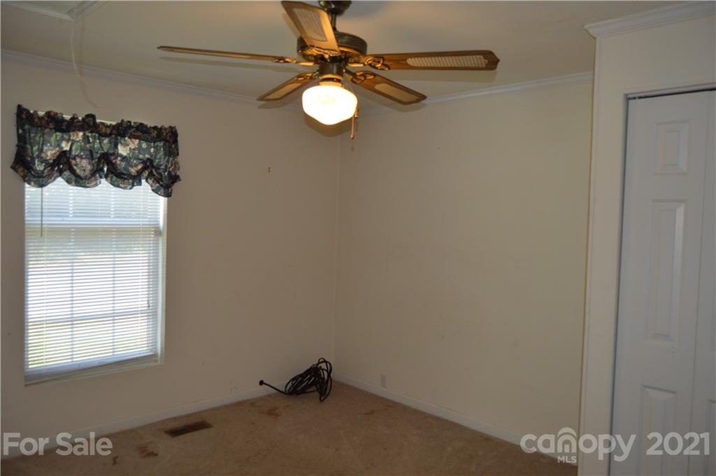 10835 Cool Springs Road Woodleaf, NC 27054 - Photo 12 of 35 a bathroom with a sink and a mirror