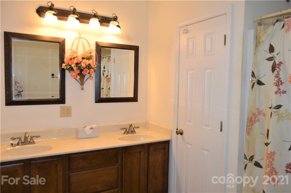 10835 Cool Springs Road Woodleaf, NC 27054 - Photo 15 of 35 a bathroom with a double vanity sink mirror and