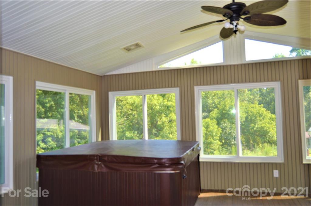 10835 Cool Springs Road Woodleaf, NC 27054 - Photo 16 of 35 a room with a window and a chandelier