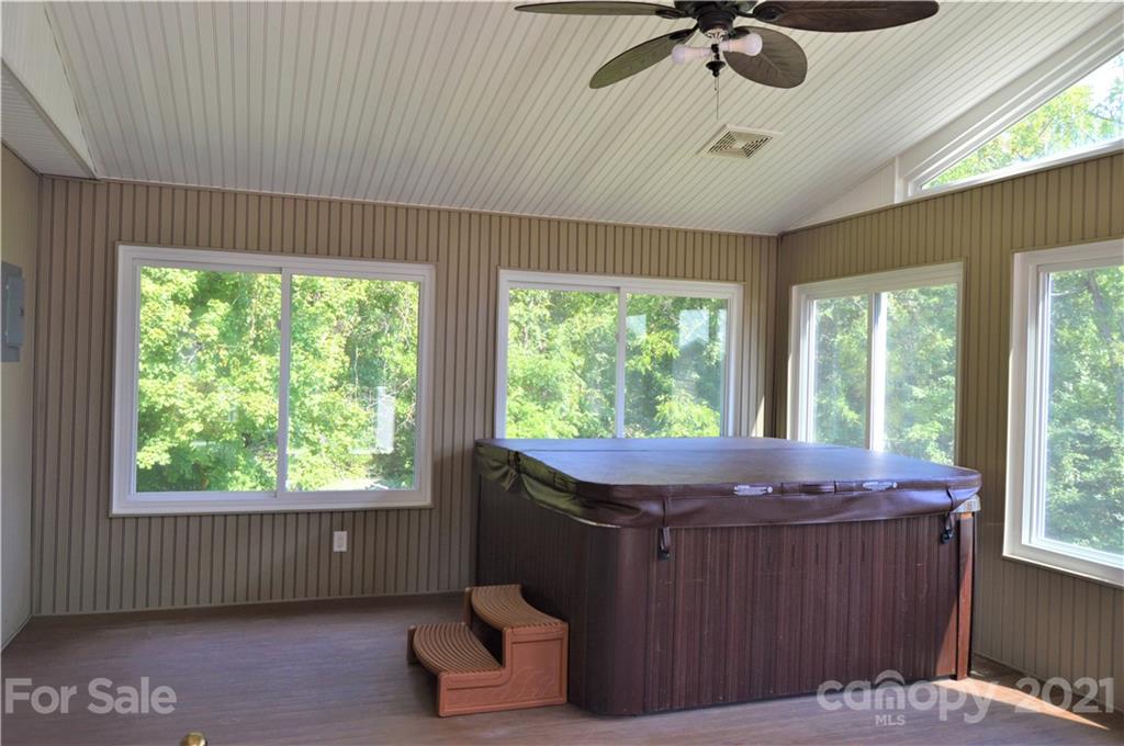 10835 Cool Springs Road Woodleaf, NC 27054 - Photo 17 of 35 a room with furniture and a window