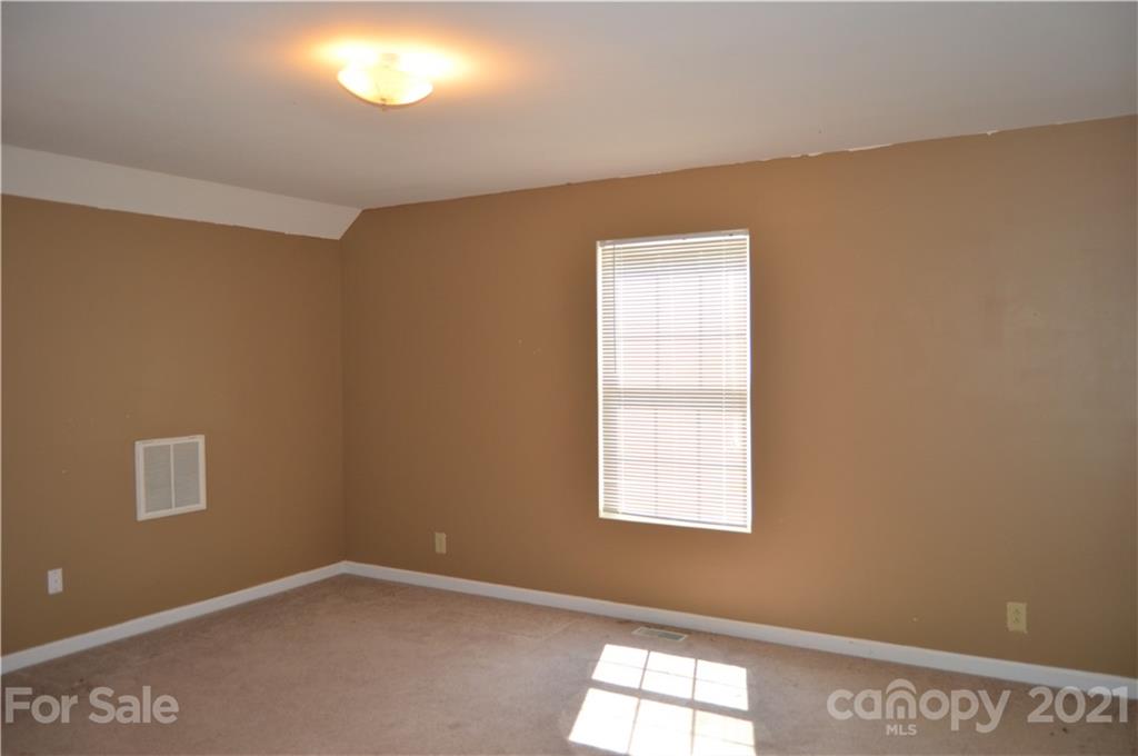 10835 Cool Springs Road Woodleaf, NC 27054 - Photo 25 of 35 an empty room with a window