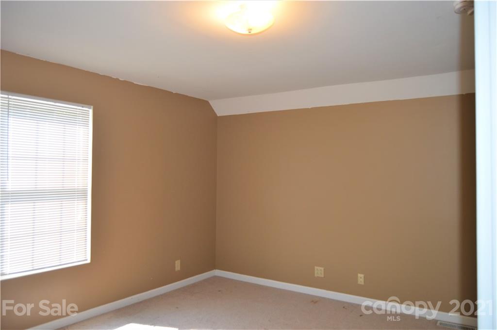 10835 Cool Springs Road Woodleaf, NC 27054 - Photo 26 of 35 an empty room with a window
