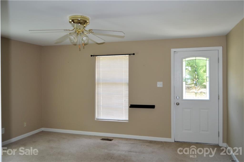 10835 Cool Springs Road Woodleaf, NC 27054 - Photo 4 of 35 an empty room with a window