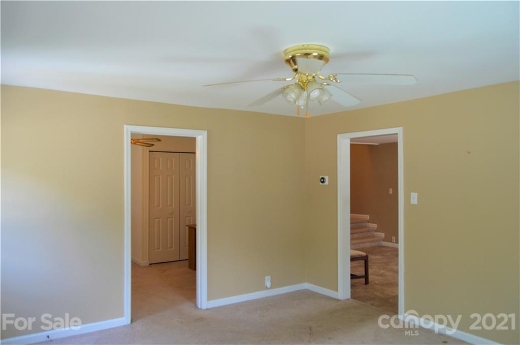 10835 Cool Springs Road Woodleaf, NC 27054 - Photo 7 of 35 a view of a hallway with a chandelier