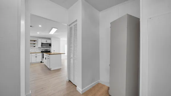 a view of kitchen with stainless steel appliances refrigerator oven microwave and stove