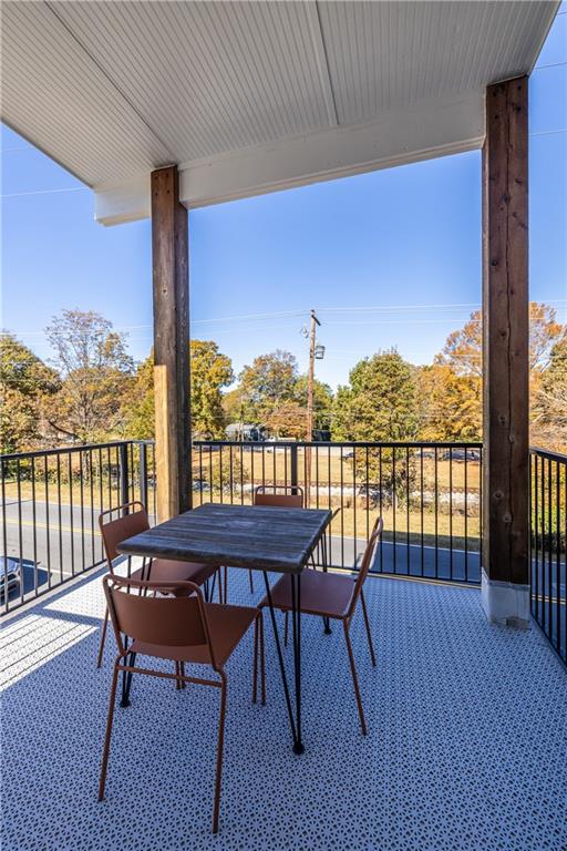 812 West College Avenue Decatur, GA 30030 - Photo 19 of 32 a view of a balcony with furniture and wooden floor