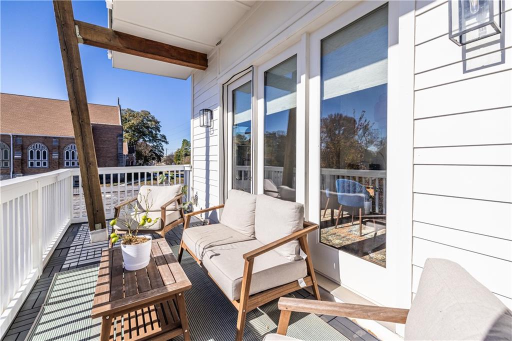 812 West College Avenue Decatur, GA 30030 - Photo 6 of 32 a view of balcony with chairs and wooden floor