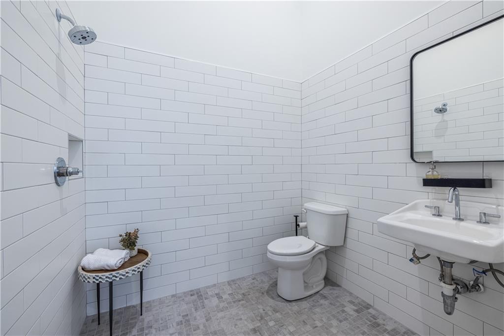 812 West College Avenue Decatur, GA 30030 - Photo 10 of 32 a bathroom with a toilet sink and mirror