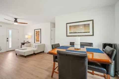 a work room with furniture and wooden floor
