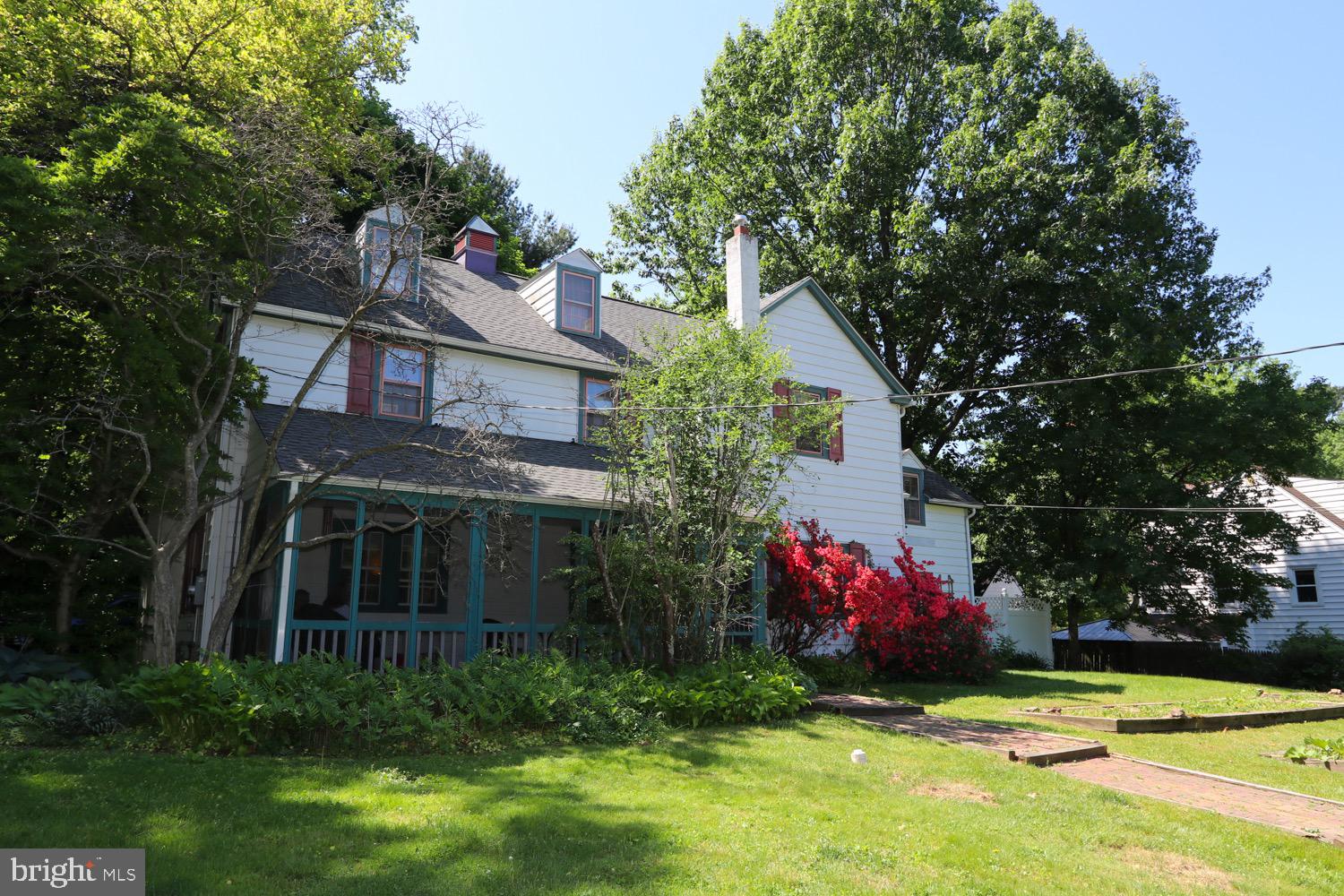2701 Alden Road Bryn Athyn, PA 19006 - Photo 11 of 105 a front view of house with yard and trees