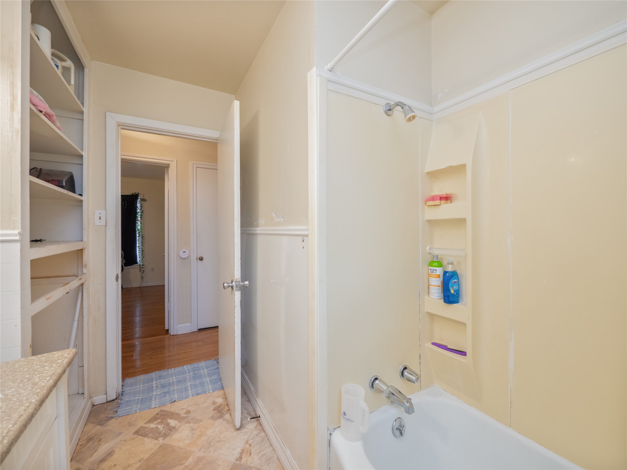 1910 South 13th Street Temple, TX 76504 - Photo 20 of 35 a bathroom with a bathtub and shower
