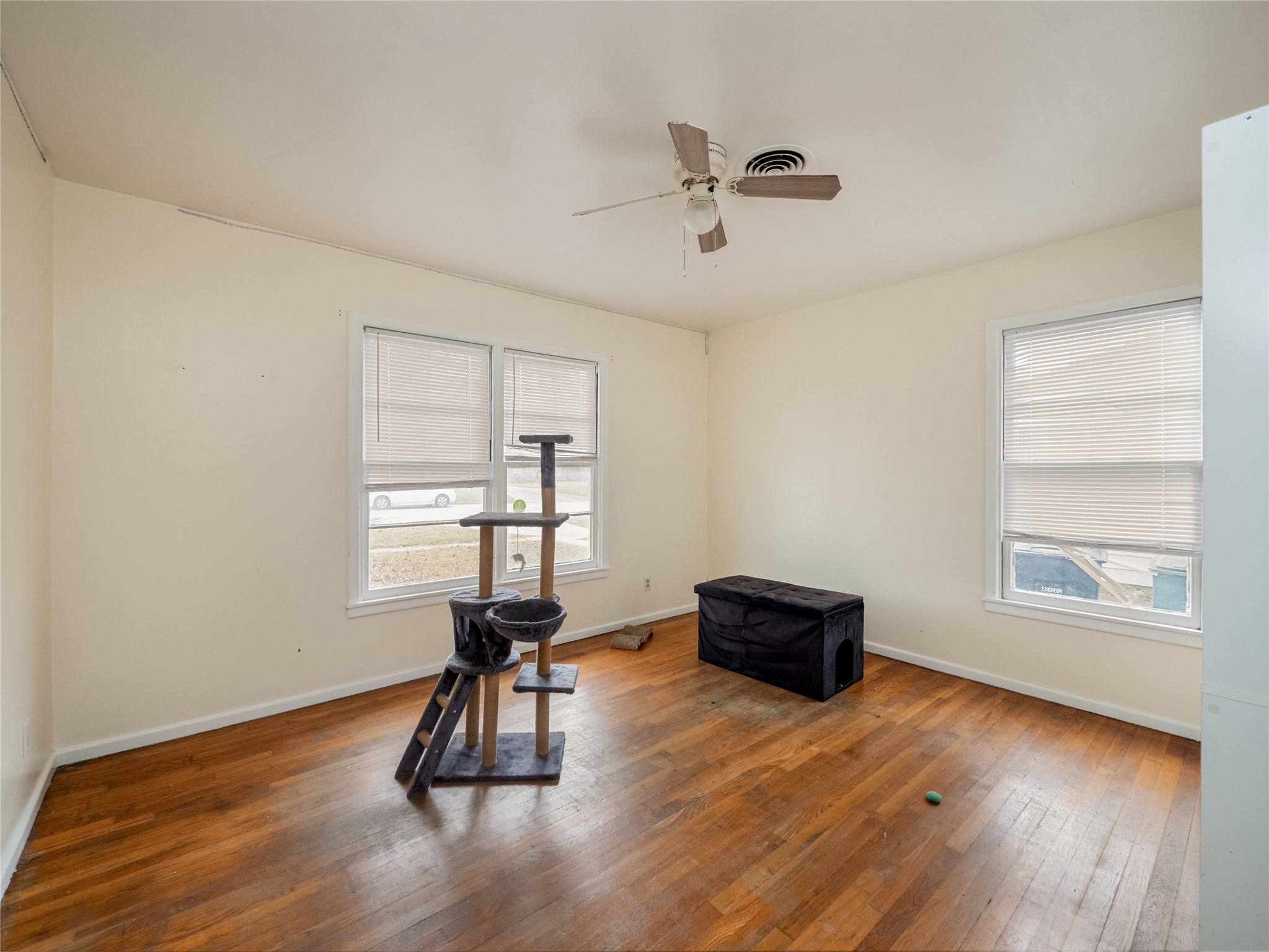 1910 South 13th Street Temple, TX 76504 - Photo 21 of 35 a room with window and wooden floor