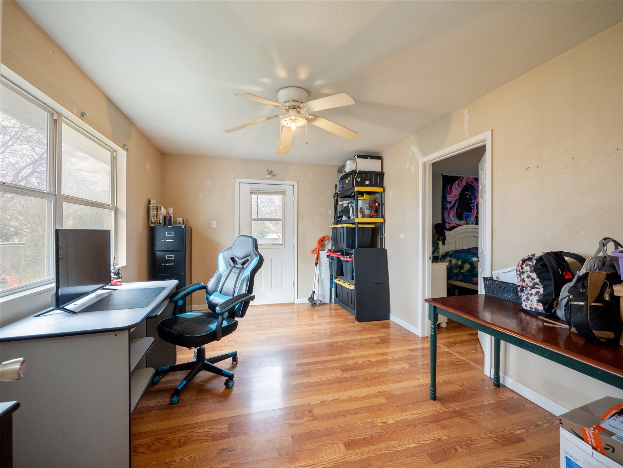 1910 South 13th Street Temple, TX 76504 - Photo 27 of 35 a workspace with furniture window and wooden floor