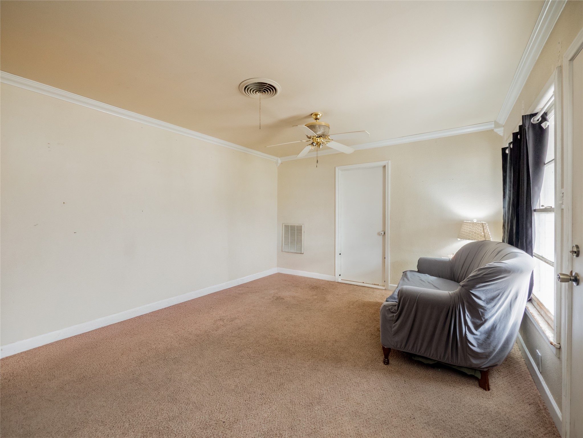 1910 South 13th Street Temple, TX 76504 - Photo 5 of 35 a living room with furniture and a chandelier