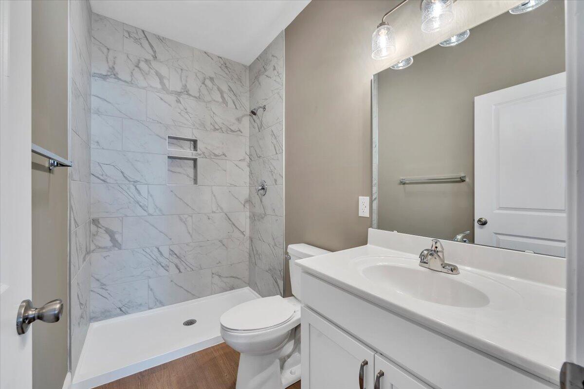 5615 Huntridge Road Roanoke, VA 24019 - Photo 12 of 21 a bathroom with a sink a toilet and shower