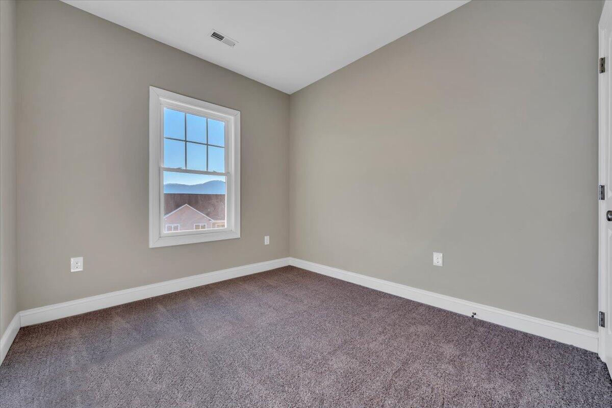 5615 Huntridge Road Roanoke, VA 24019 - Photo 14 of 21 a view of an empty room with a window